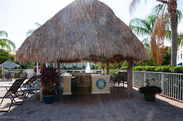 view of patio with a gazebo and an outdoor kitchen