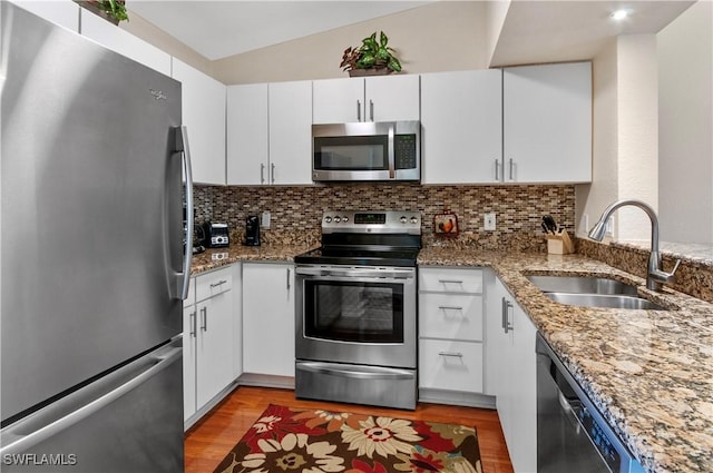 kitchen featuring sink, white cabinets, and appliances with stainless steel finishes