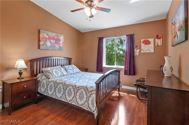 bedroom featuring ceiling fan, wood-type flooring, and vaulted ceiling