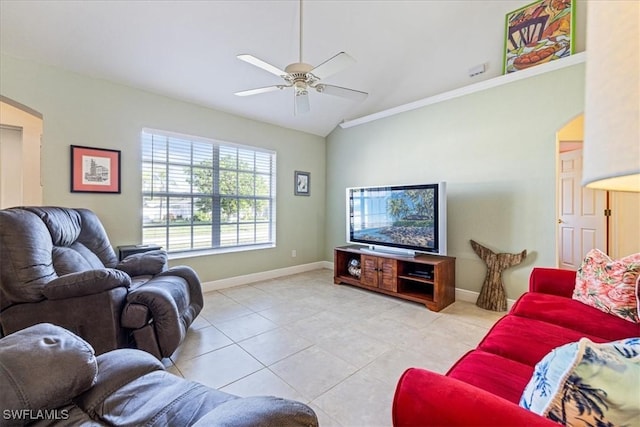 living room with light tile patterned floors, ceiling fan, and lofted ceiling