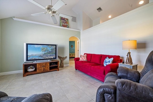 living room with ceiling fan, light tile patterned floors, ornamental molding, and high vaulted ceiling