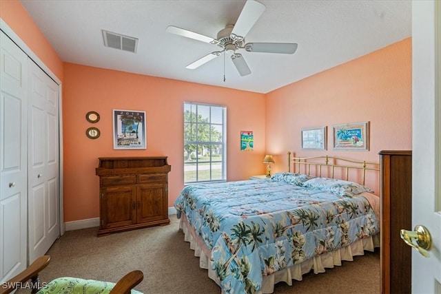 bedroom featuring ceiling fan, a closet, and light colored carpet