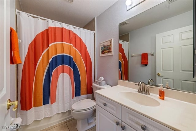 full bathroom with vanity, tile patterned floors, toilet, shower / bathtub combination with curtain, and a textured ceiling