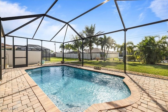 view of pool with a lanai, a yard, and a patio