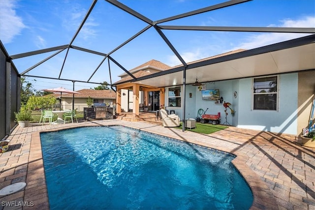 view of pool with a lanai and a patio area