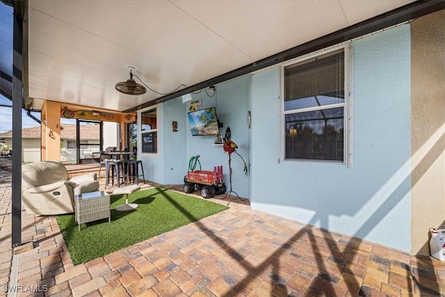 view of patio featuring ceiling fan