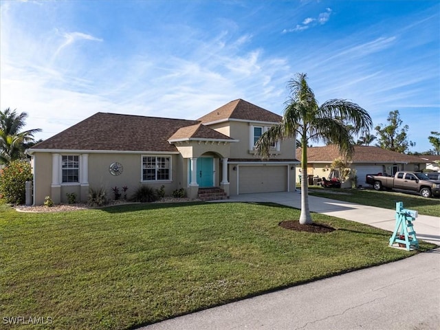 view of front of house featuring a garage and a front lawn