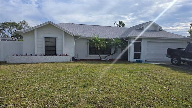 single story home featuring a front yard and a garage