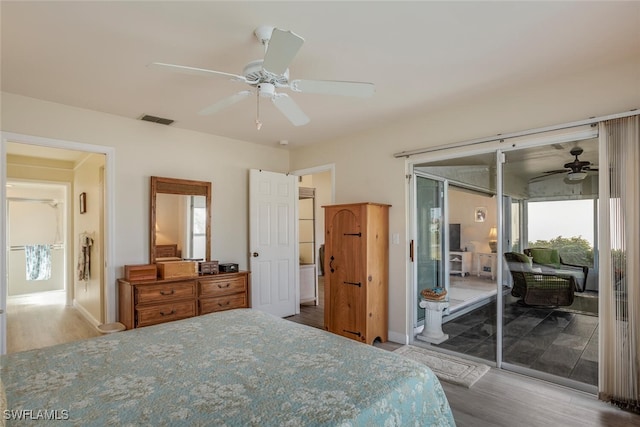 bedroom featuring access to exterior, ceiling fan, and hardwood / wood-style flooring