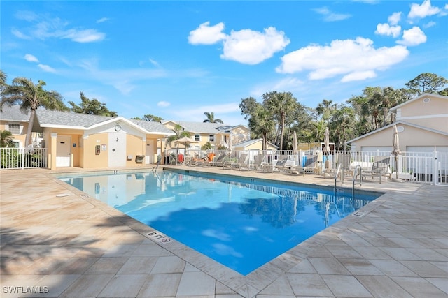 view of swimming pool with a patio area