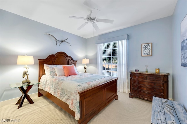 651 Wiggins Lake Dr Unit 101, Naples, FL 34110 - bedroom featuring light colored carpet and ceiling fan