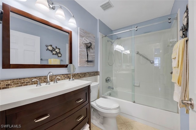 full bathroom with vanity, tile patterned flooring, toilet, enclosed tub / shower combo, and tasteful backsplash