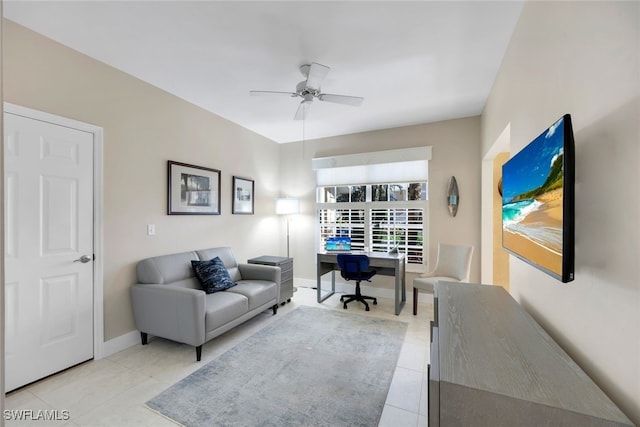 office area with ceiling fan and light tile patterned floors