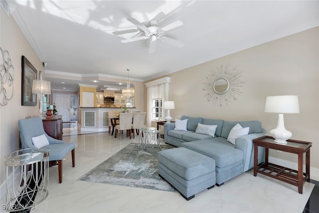 living room with crown molding and ceiling fan