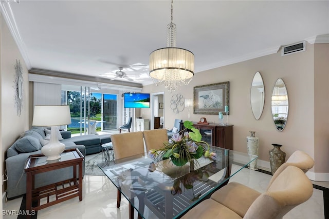 dining room featuring ceiling fan with notable chandelier and ornamental molding