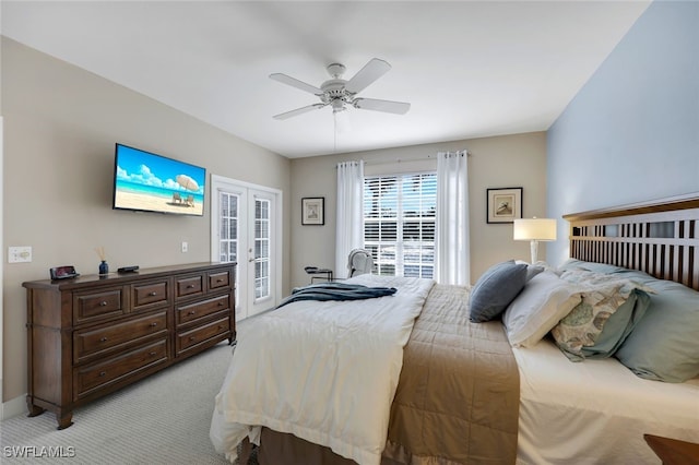 bedroom featuring access to exterior, ceiling fan, french doors, and light carpet