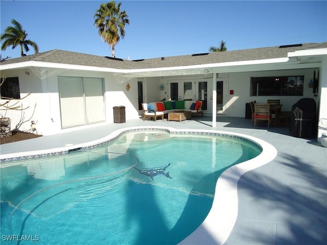 view of swimming pool featuring outdoor lounge area and a patio