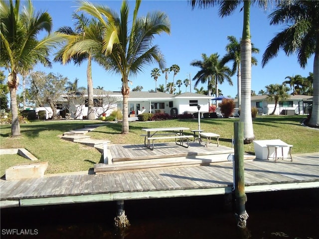 view of community with a wooden deck and a yard