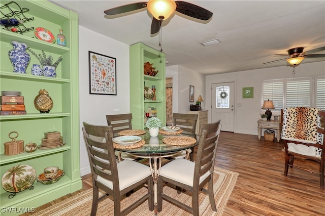 dining area featuring ceiling fan and hardwood / wood-style flooring