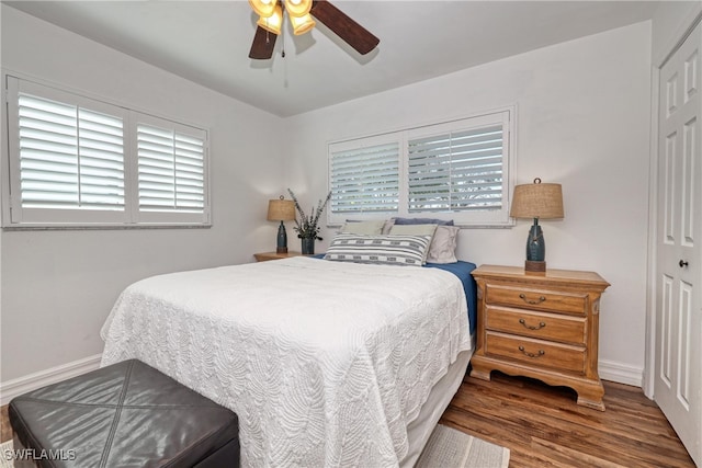 bedroom featuring a closet, ceiling fan, and dark wood-type flooring