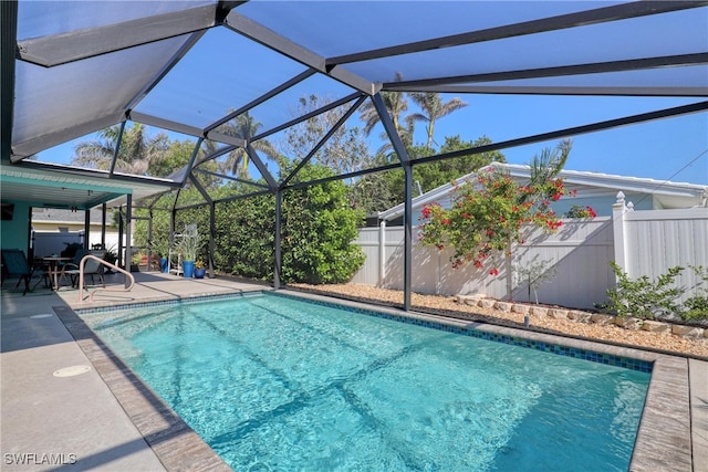 view of pool with a lanai and a patio