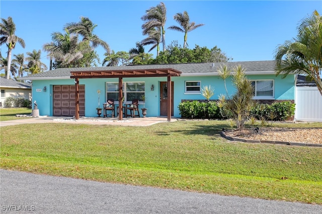 single story home with a front yard and a garage