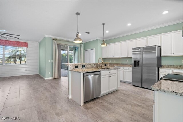 kitchen with white cabinetry, sink, decorative light fixtures, and appliances with stainless steel finishes