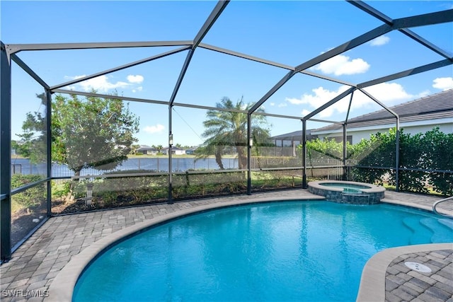 view of pool with glass enclosure and a water view