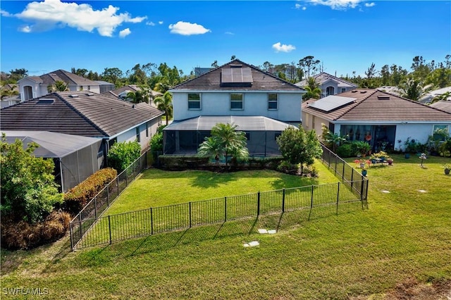 exterior space with a lanai and a yard