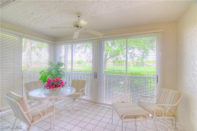 sunroom / solarium with ceiling fan and a wealth of natural light