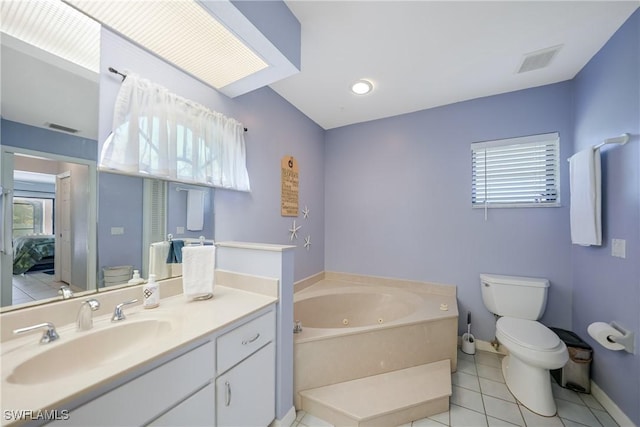 bathroom with tile patterned floors, vanity, a bath, and toilet