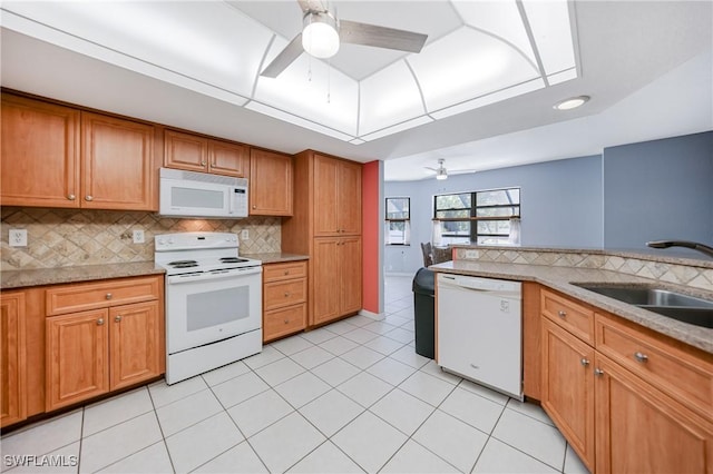 kitchen with backsplash, white appliances, ceiling fan, sink, and light tile patterned floors