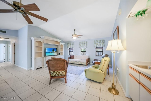 tiled living room featuring sink and lofted ceiling