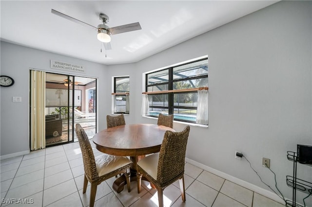 tiled dining area with ceiling fan