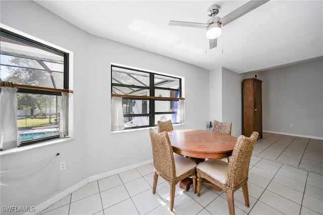 dining room with light tile patterned floors, plenty of natural light, and ceiling fan