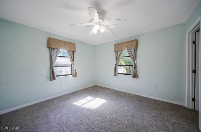 empty room featuring ceiling fan and carpet floors