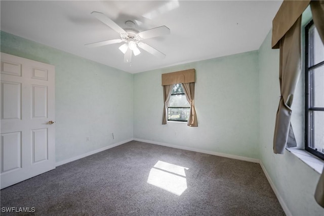 carpeted empty room with ceiling fan