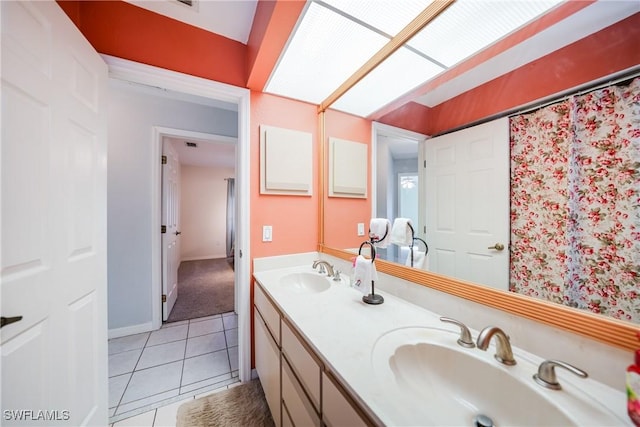 bathroom featuring tile patterned flooring and vanity