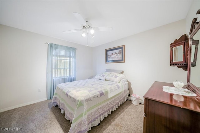 bedroom with ceiling fan and light colored carpet