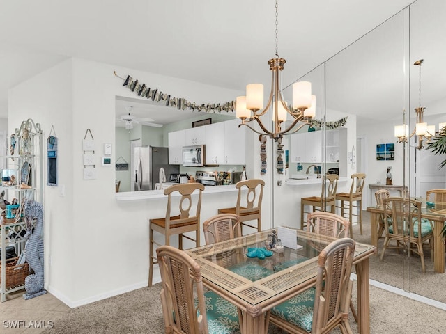 dining area with ceiling fan with notable chandelier