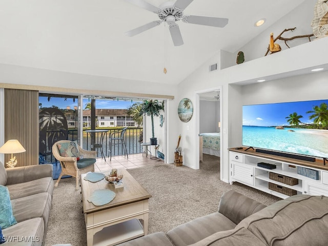 carpeted living room with high vaulted ceiling and ceiling fan