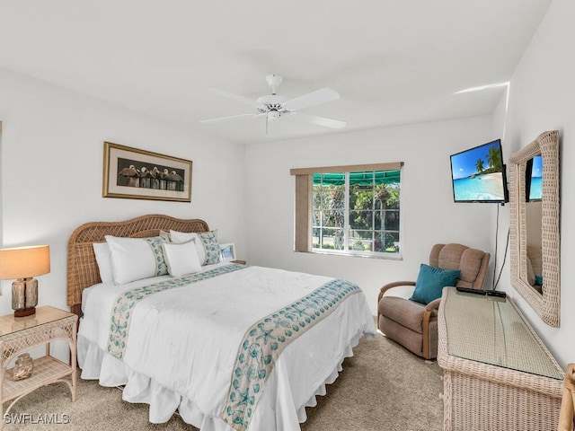 bedroom featuring ceiling fan and light carpet