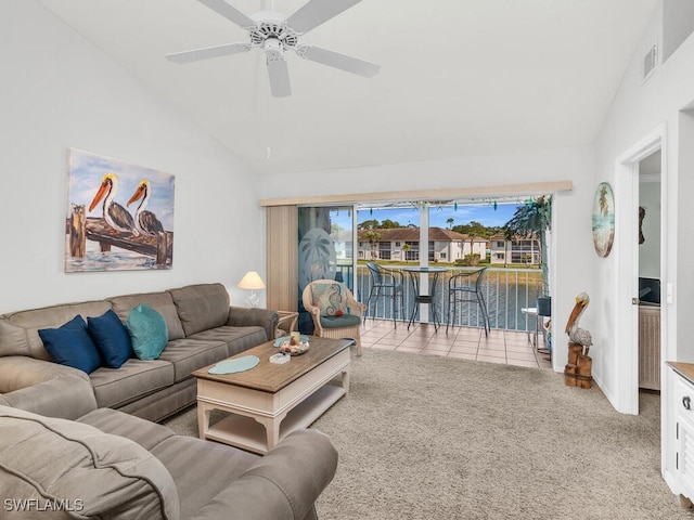 living room featuring ceiling fan, a water view, light carpet, and high vaulted ceiling