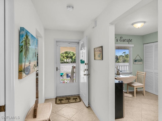 entryway featuring light tile patterned flooring