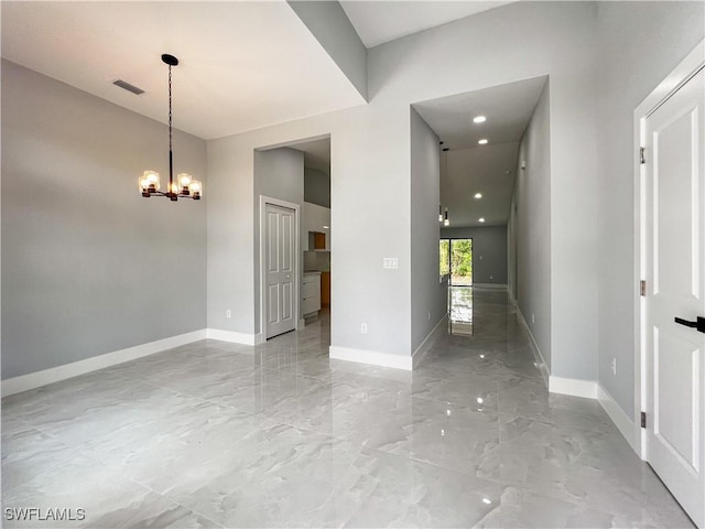 foyer entrance featuring a chandelier