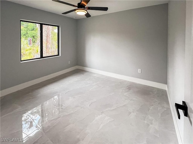 unfurnished room featuring ceiling fan