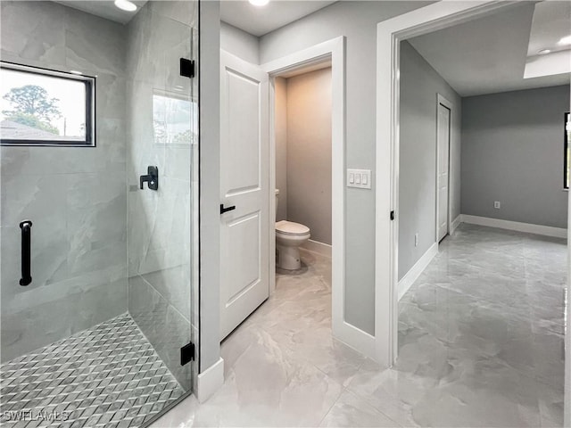 bathroom with toilet and walk in shower