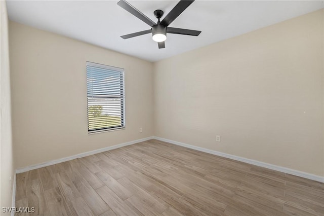 spare room featuring ceiling fan and light hardwood / wood-style floors