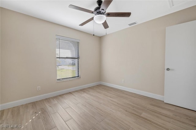 empty room featuring light wood-type flooring and ceiling fan