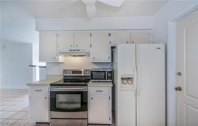 kitchen featuring white cabinets, light tile patterned floors, and stainless steel appliances